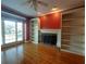 Cozy living room with a fireplace, built-in bookshelves, and lots of natural light at 1272 Saxony Se Dr, Conyers, GA 30013
