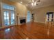 Inviting living room with a cozy fireplace and French doors at 1272 Saxony Se Dr, Conyers, GA 30013