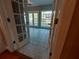 Enclosed sunroom featuring natural light through French doors at 1272 Saxony Se Dr, Conyers, GA 30013