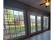Bright sunroom with large windows and a backyard view at 1272 Saxony Se Dr, Conyers, GA 30013