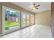 Bright sunroom featuring large windows and tile flooring overlooking a backyard at 1272 Saxony Se Dr, Conyers, GA 30013