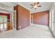 Bright sunroom featuring a brick wall, tile floors, and multiple access doors at 1272 Saxony Se Dr, Conyers, GA 30013