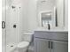 Modern bathroom featuring glass enclosed shower, a gray vanity and neutral decor at 2019 Fern Mountain Ln, Marietta, GA 30064