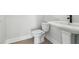Bright bathroom with a toilet and pedestal sink at 2019 Fern Mountain Ln, Marietta, GA 30064