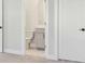 Neutral toned bathroom with a sink, toilet and simple decor at 2019 Fern Mountain Ln, Marietta, GA 30064