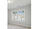 Bright bedroom features neutral decor and large window with neighborhood views at 2019 Fern Mountain Ln, Marietta, GA 30064