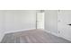 Bright bedroom featuring white walls and doors with neutral carpeted floors at 2019 Fern Mountain Ln, Marietta, GA 30064