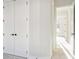 White doors with black hardware in the hallway at 2019 Fern Mountain Ln, Marietta, GA 30064