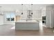 Open-concept kitchen with a large island, modern appliances, and views to the dining area at 2019 Fern Mountain Ln, Marietta, GA 30064