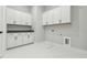 Bright laundry room featuring white cabinets and modern appliances at 2019 Fern Mountain Ln, Marietta, GA 30064