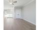 Spacious living room features light hardwood floors, neutral decor and large windows at 2019 Fern Mountain Ln, Marietta, GA 30064