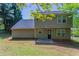 Two-story home featuring large backyard with small patio at 2386 Mills Bnd, Decatur, GA 30034