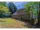 Two-story home featuring large backyard and shade trees at 2386 Mills Bnd, Decatur, GA 30034