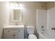 Well-lit bathroom with a shower-tub combo, vanity, and modern fixtures at 2386 Mills Bnd, Decatur, GA 30034