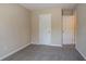 Bedroom featuring neutral paint, plush carpeting, and two interior doors at 2386 Mills Bnd, Decatur, GA 30034