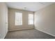 Bright bedroom with natural light from two windows and plush carpeting at 2386 Mills Bnd, Decatur, GA 30034