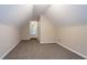 Cozy bedroom showcasing plush carpeting, neutral paint, and access to connecting rooms at 2386 Mills Bnd, Decatur, GA 30034