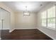 Bright dining area boasting stylish lighting, neutral walls, and rich dark wood flooring at 2386 Mills Bnd, Decatur, GA 30034