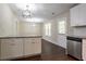 Bright kitchen with island, stainless steel dishwasher and modern pendant lighting at 2386 Mills Bnd, Decatur, GA 30034