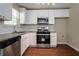 Modern kitchen featuring white cabinets, stainless steel appliances, and granite countertops at 2386 Mills Bnd, Decatur, GA 30034