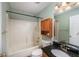 Full bathroom features tiled shower and granite countertop at 4715 Hill Rd, Powder Springs, GA 30127