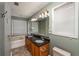 Bathroom with double sinks, granite countertop, and natural light at 4715 Hill Rd, Powder Springs, GA 30127