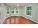 Bright bedroom with hardwood floors, bay window, and neutral colored paint at 4715 Hill Rd, Powder Springs, GA 30127