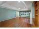 A spacious living room features hardwood floors, tray ceilings, a fireplace, and natural light at 4715 Hill Rd, Powder Springs, GA 30127