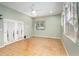 Large living room with tile floors, a ceiling fan, and many windows at 4715 Hill Rd, Powder Springs, GA 30127
