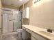 Cozy bathroom featuring a shower over tub, ample vanity space, and sleek fixtures at 102 Silver Summit Se Dr, Conyers, GA 30094