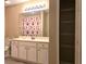 Bathroom featuring a shower and a white vanity cabinet with a large mirror at 102 Silver Summit Se Dr, Conyers, GA 30094