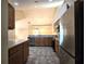 Well-lit kitchen featuring stainless steel appliances, light wood cabinets, and complementary countertop backsplash at 102 Silver Summit Se Dr, Conyers, GA 30094