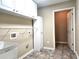 Functional laundry area with sink, cabinets, and plenty of space for cleaning at 102 Silver Summit Se Dr, Conyers, GA 30094