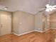 Open concept living room with hardwood floors, neutral paint, and natural light at 102 Silver Summit Se Dr, Conyers, GA 30094