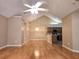 Large living room with hardwood floors, an open floor plan, and vaulted ceilings at 102 Silver Summit Se Dr, Conyers, GA 30094