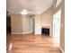 Spacious living room featuring a fireplace, wood floors, and access to the sunroom at 102 Silver Summit Se Dr, Conyers, GA 30094
