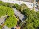 Scenic aerial view featuring an apartment building amidst lush greenery and a parking area at 1234 Weatherstone Ne Dr, Atlanta, GA 30324
