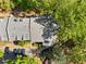 Aerial view of the property showing the roof, lush surroundings, and convenient parking area at 1234 Weatherstone Ne Dr, Atlanta, GA 30324
