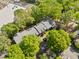 An aerial view of a charming apartment complex nestled among lush trees with ample parking at 1234 Weatherstone Ne Dr, Atlanta, GA 30324
