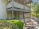 Lattice design lines the porch of this two-story condo with a pathway through the landscaping at 1234 Weatherstone Ne Dr, Atlanta, GA 30324