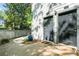 Exterior shot of two gray doors with a small window and a blue pot with plants at 1234 Weatherstone Ne Dr, Atlanta, GA 30324