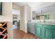 Pass through kitchen features stainless steel appliances and a view into the living room at 1234 Weatherstone Ne Dr, Atlanta, GA 30324