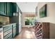 Well-lit kitchen with stainless steel refrigerator and a large wine rack at 1234 Weatherstone Ne Dr, Atlanta, GA 30324