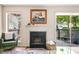 Comfortable living room featuring a fireplace, hardwood floors, and a sliding glass door to the patio at 1234 Weatherstone Ne Dr, Atlanta, GA 30324