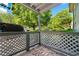 Enclosed patio area with lattice featuring views of lush landscaping and a serene outdoor setting at 1234 Weatherstone Ne Dr, Atlanta, GA 30324