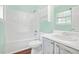Bathroom featuring a tub shower, toilet and vanity with laminate flooring at 1248 To Lani Ct, Stone Mountain, GA 30083