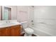 Clean bathroom featuring a vanity, toilet, and shower-tub combo at 1248 To Lani Ct, Stone Mountain, GA 30083
