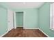 Bright bedroom with a walk-in closet, fresh paint, and laminate flooring at 1248 To Lani Ct, Stone Mountain, GA 30083
