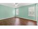 A bright bedroom with two windows, laminate flooring and neutral walls at 1248 To Lani Ct, Stone Mountain, GA 30083