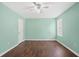 This bright bedroom has laminate flooring, a ceiling fan, and neutral walls at 1248 To Lani Ct, Stone Mountain, GA 30083